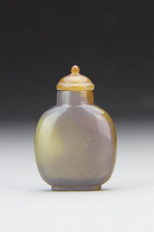 Chinese Carved Agate Snuff Bottle: Finely polished and carved of simple form to show natural properties of stone, complete with matching stopper, 2.25"H. From the collection of David Bell who worked for an Italian steel company in Chin