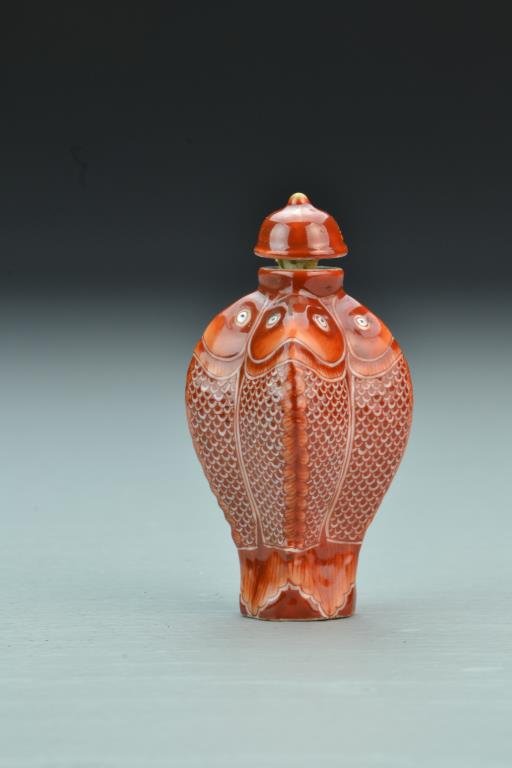 Chinese Porcelain Snuff Bottle: Having unique form, painted to appear as four fish with top fin as ridges on bottle, detailed scales and fins, base bearing four character mark in iron red underglaze, complete with matching stopper,