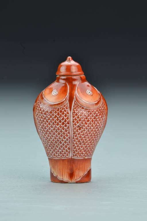 Chinese Porcelain Snuff Bottle: Having unique form, painted to appear as fish with top fin as ridge on bottle, detailed scales and fins, base bearing three character mark in iron red underglaze, complete with matching stopper, 3"H.