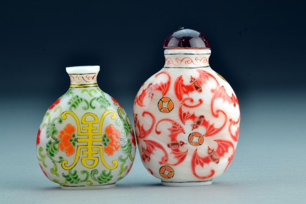 (2) Chinese Peking Glass Snuff Bottles: Finely painted to depict bats and symbol within floral design, bases bearing three character mark, one with slight chip to base and mouth, tallest is 3.4"H. From the collection of David Bell who worke
