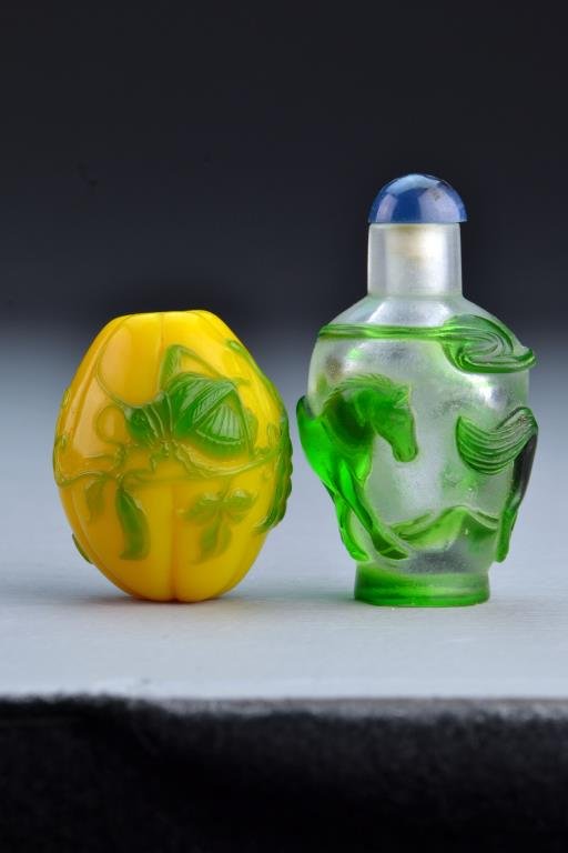 (2) Chinese Peking Glass Snuff Bottles: One formed in shape of gourd with fine cricket and pea overlay, the other with overlay depicting horses, tallest is 2.6"H. From the collection of David Bell who worked for an Italian steel company in 