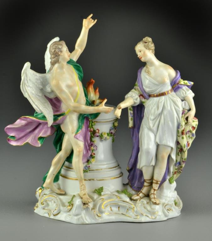 Meissen Porcelain Figural Sculpture: Depicting allegorical figures, Meissen cross swords mark in underglaze blue, further impressed numbers 2449. Condition, with losses to two fingers on female, possible restoration to base by females fo
