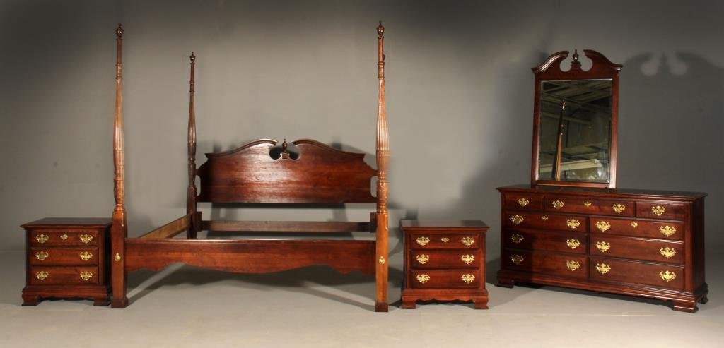 (5) Pc. Kincaid Chippendale Style Bedroom Set: Mahogany bedroom set includes, king-size four poster bed, a long dresser, two night stands and a vertical mirror, all drawers with brass pulls, largest is 84" H x 80.5" W x 90" L , circa 20th century.