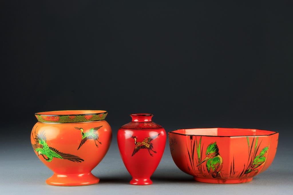 (3) Pcs. Shelley Bone China Art Deco: To include an octagonal bowl, a small vase, and a footed jar, all finely painted to depict waterfowl against an orange or red ground, largest is 6.75"D. Private collection Oxford, Michigan.