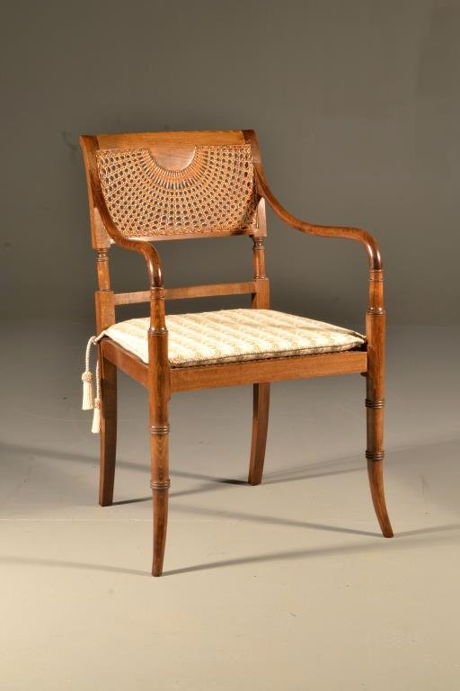 Spanish Sheraton Style Cane Back Open Arm Chair: Possibly walnut having caned back and seat with upholstered cushion and tassels, 3.5" H x 20" W x 18" D, circa mid 20th century. Condition, very good.