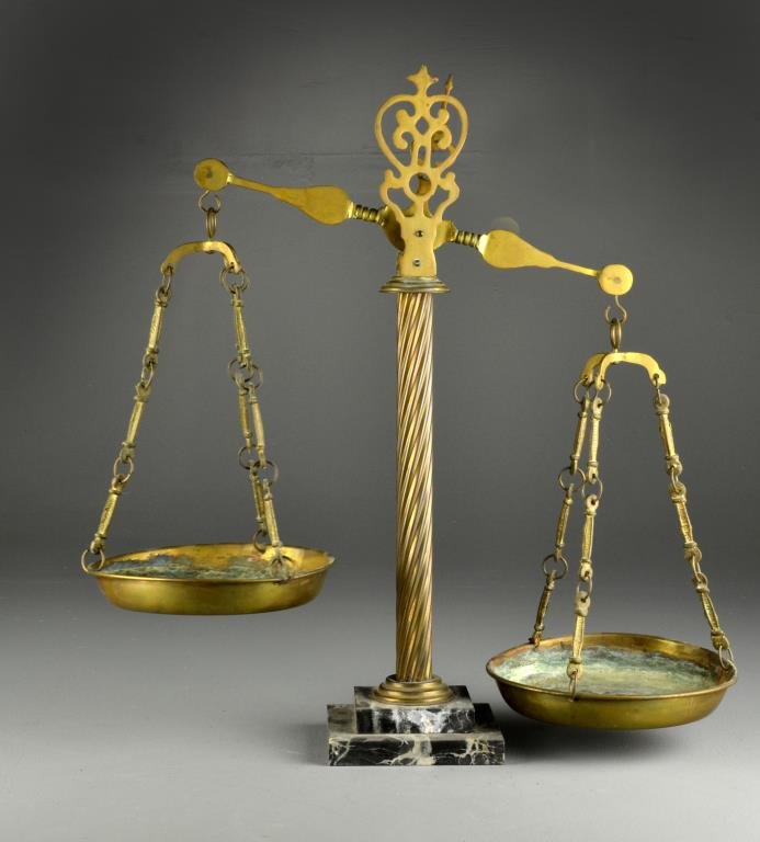 An Italian Brass & Marble Fitted Scales: Having a scrolled top shaped arm with block and chain aperture holding the brass pans, raised on stepped marble base, 22"H circa early to mid-20th century. Property of a Grosse Ille, Michigan collecto