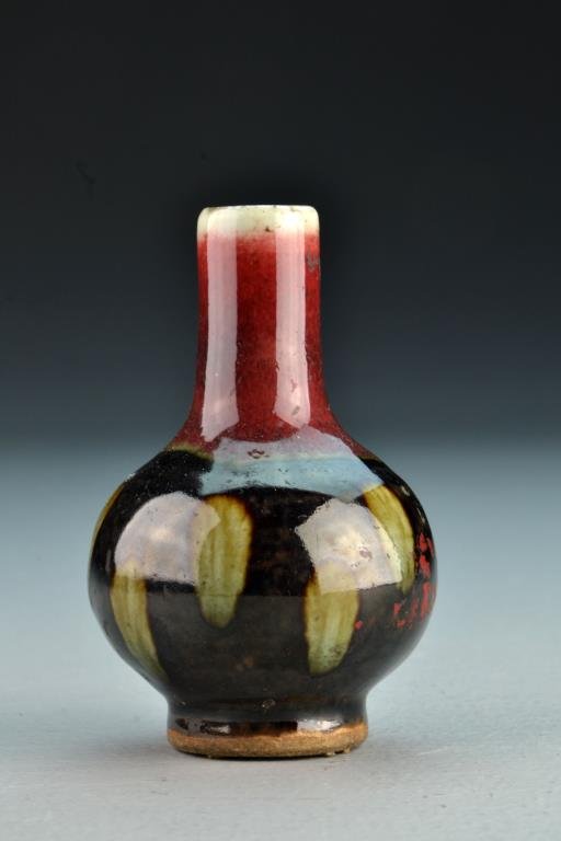 A Fine Chinese Qing Peachbloom Porcelain Vase: Of traditional form, having multi colored glaze, and having six character mark and under glaze blue to footrim, 5.125" H circa 19th Century. Collection of the Late Robert Willis owner of R.F. Willis G