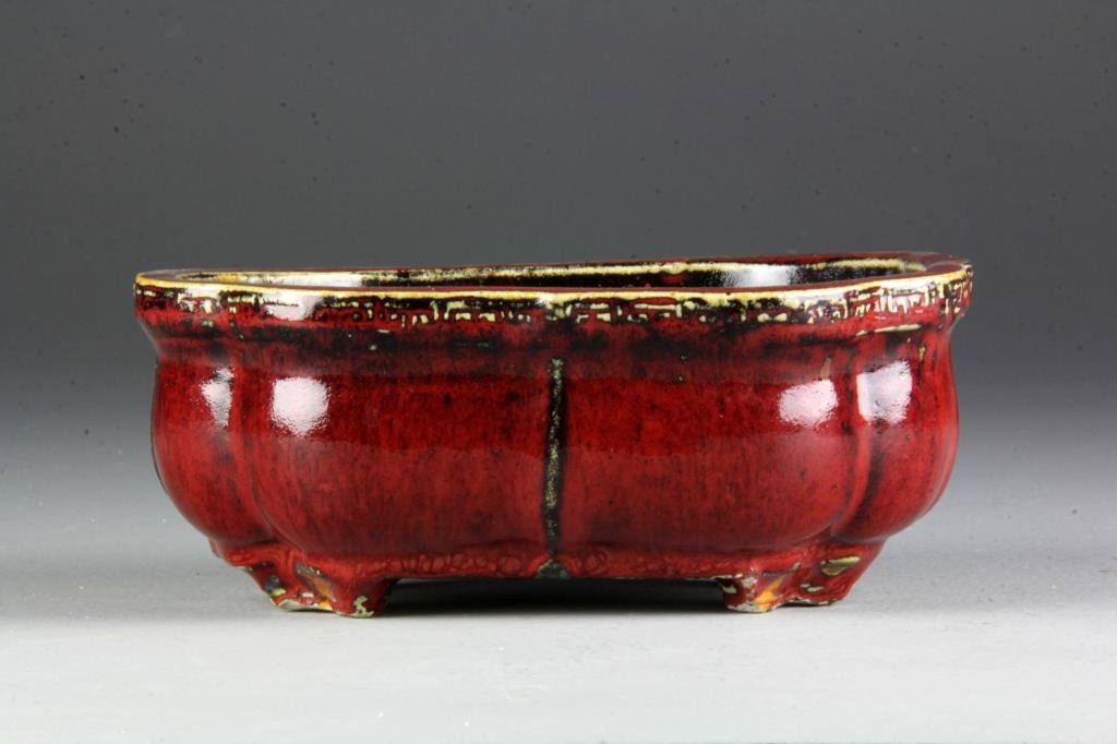 Chinese Qing Flambe Glazed Porcelain Planter: Covered all over in a rich strawberry glaze, stamped made in China, and having its original paper label to underside, 8.25"W, circa 19th century. Collection of the Late Robert Willis owner of R.F. Wil