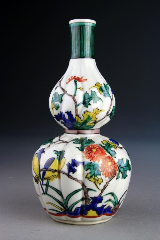 A Japanese Polychrome Painted Double Vase: Depicting songbirds, lotus and rocky outcrops, signed to footrim within a glazed green square, 7.375" H circa 19th-early 20th Century. Collection of the Late Robert Willis owner of R.F. Willis Galleri