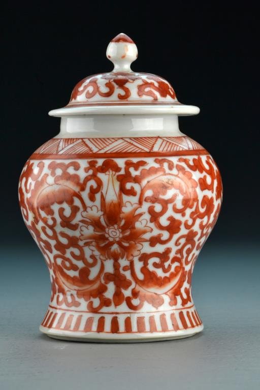 Chinese Qing Iron Red Porcelain Jar: Decorated with lotus blossoms and tendrils, with red China stamp to base, 6.25"H, circa 19th century. Collection of the Late Robert Willis owner of R.F. Willis Galleries, Grand Rapids, Michigan.