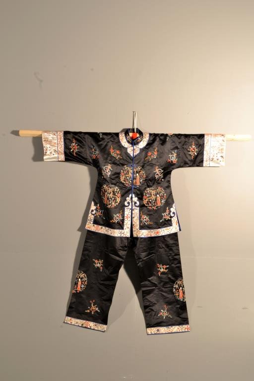 (2) Pcs. Chinese Silk Embroidered Clothing: To include a shirt and pair of pants embroidered to depict figures and flowers, size small. Property of an Auburn Hills, Michigan Couple.