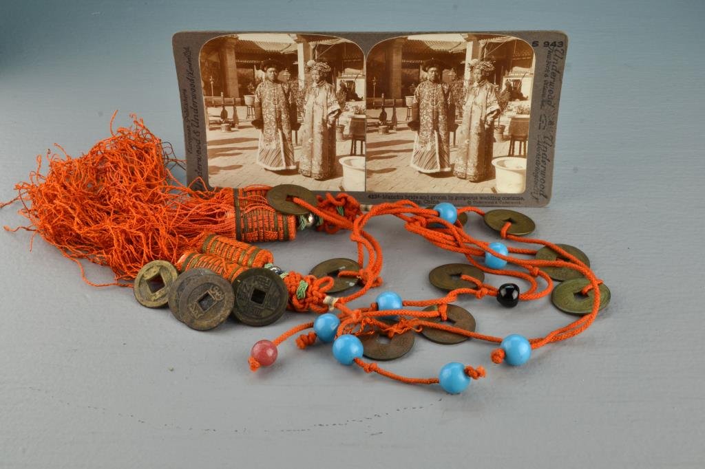 (7) Pcs. Chinese Decorative Arts: Consisting of an antique photo of a Manchu bride and groom for a viewfinder, four Qing Dynasty or later coins, and two hanging ornaments made of an iron red cord hung with antique coins and glass bead