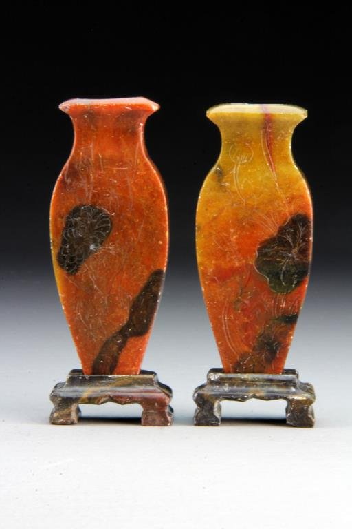 Pr. Chinese Qing Chinese Carved Soapstone Vases: Each carved to depict lotus blossoms and tendrils, raised on fitted soapstone stands, 5" H including the stands, circa late 19th-early 20th century.
