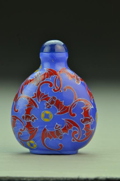 Chinese Peking Glass Snuff Bottle: Finely painted to depict overlapping bat design, base bearing three character mark in iron red, complete with stopper, 2.9"H. From the collection of David Bell who worked for an Italian steel company 