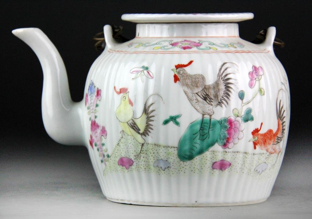 Chinese Porcelain Enamelled Teapot: Ribbed porcelain teapot with metal hoop handles and flat lid, decorated with roosters and other poultry, 5" H, circa 20th century, good condition in protective brocade box.