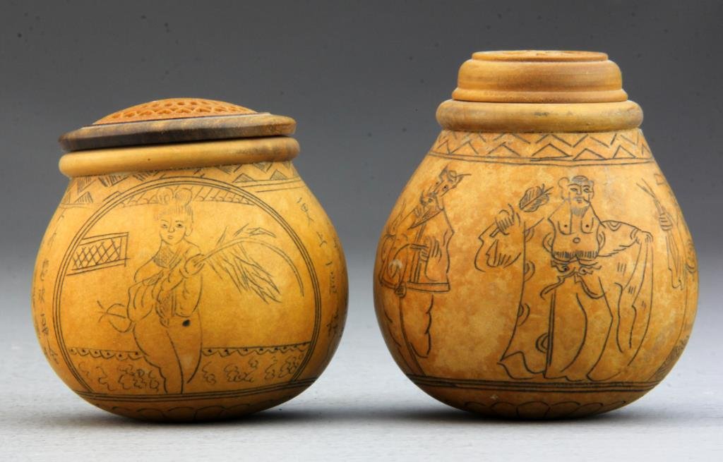 (2) Chinese Gourd Cricket Cages: One finely painted with female figures and several lines of calligraphy, other depicting figural procession, having ornately carved tops, tallest is 3.25"H.