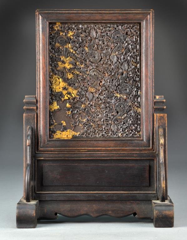 Chinese Faux Tortoise Shell Table Screen: Depicting dragons amongst ruyi clouds, 11"H X 7.75"W. Condition: Lacking portion bottom left.