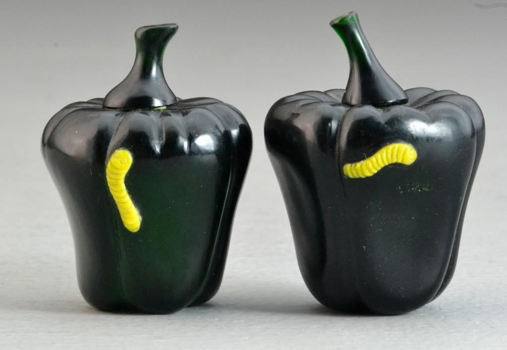 (2) Chinese Peking Glass Snuff Bottles: Finely molded dark green glass in shape of a pepper with yellow catepillar on surface, 2.5"H. Condition: broken stoppers, complete with lined box.
