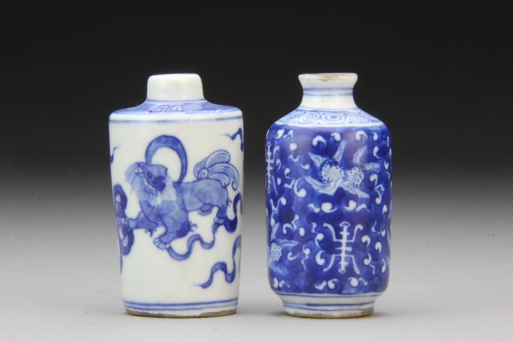 (2) Chinese Blue and White Porcelain Snuff Bottles: Finely painted to depict foo dogs, other depicting flowers and symbols, bases having two character mark in underglaze blue, 2.75"H. From the collection of David Bell who worked for an Italian steel co