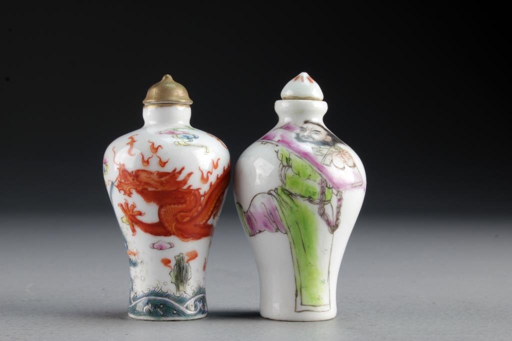 (2) Chinese Famille Rose Porcelain Snuff Bottles: One finely painted to depict five clawed dragon chasing flaming pearl among koi fish and ruyi clouds, the other depicting figure and having calligraphy, bases bearing four character mark in underglaze