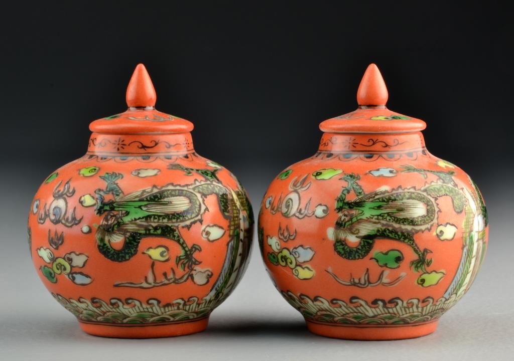 (2) Chinese Painted Porcelain Mini-Urns: Pair of covered mini-urns having finials, painted with similar depiction of phoenix, five clawed dragon, flaming pearl and ruyi clouds, bases bearing four character mark in underglaze blue, both measu