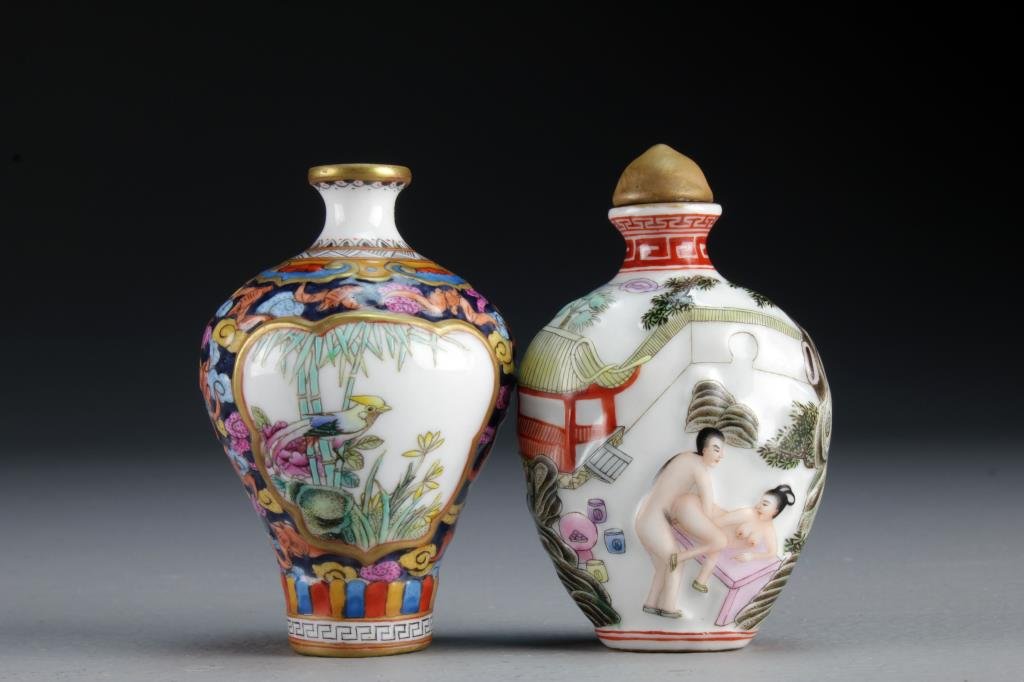 (2) Chinese Famille Rose Porcelain Snuff Bottles: One finely molded and painted to depict couple in erotic scenes with a base marked by a blue seal underglaze, the second example is painted to depict birds in landscapes with a border of bats and ruyi
