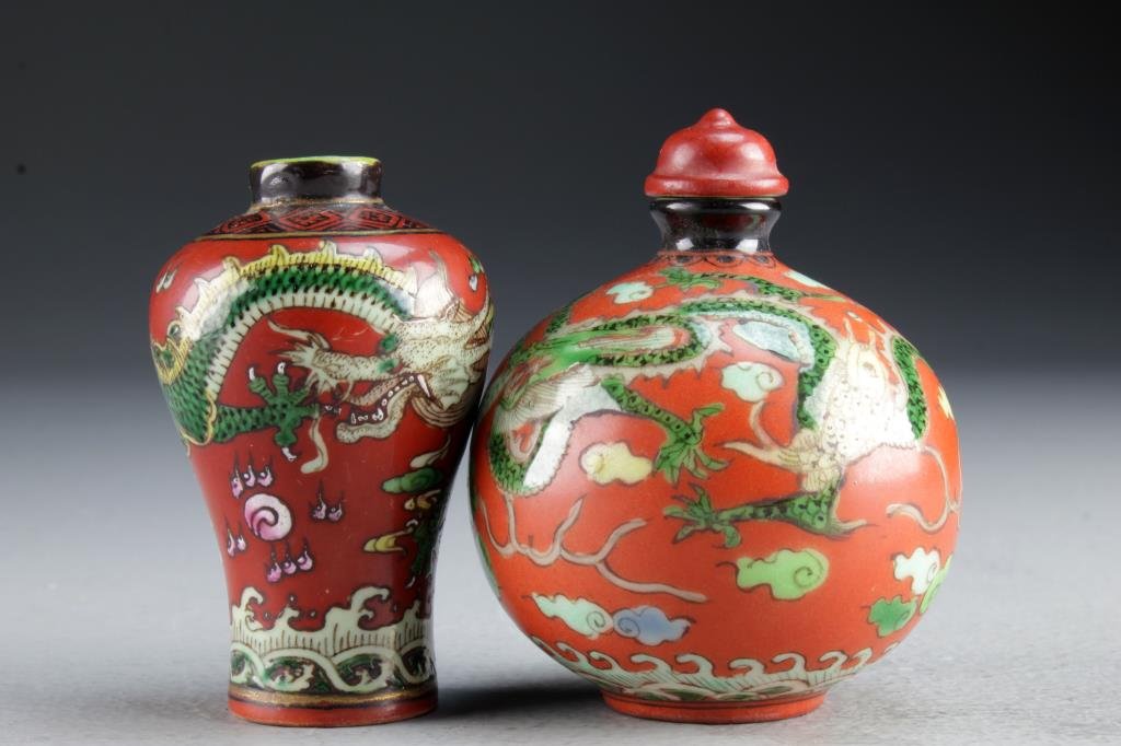 (2) Chinese Porcelain Snuff Bottles: Finely painted to depicting dragons chasing flaming pearl among ruyi clouds, one also depicting koi fish, bases bearing four character mark in underglaze blue, tallest is 3.2"H.