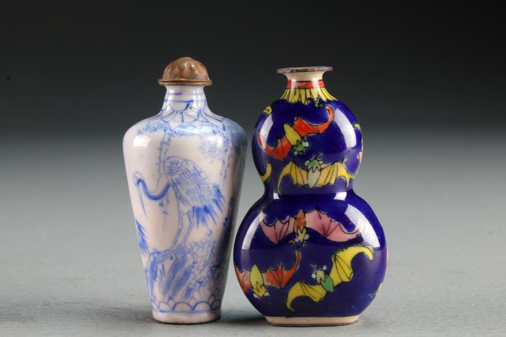 (2) Chinese Enamel Snuff Bottles: One formed as gourd and painted to depict bats, the second a monochromatic example painted to depict cranes beneath ancient tree, tallest is 2.6"H.