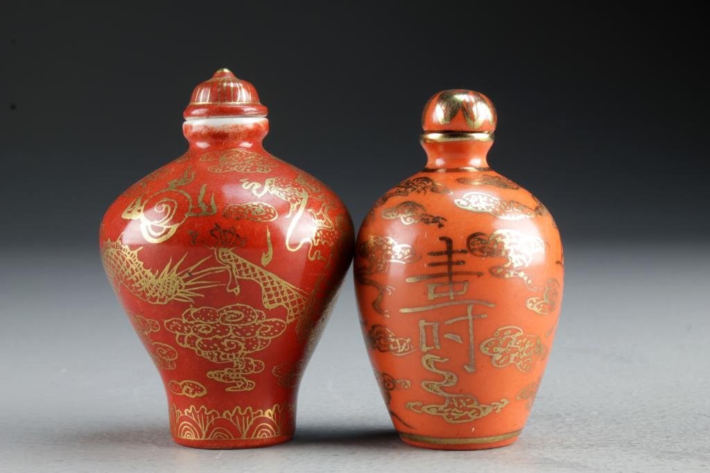 (2) Chinese Porcelain Snuff Bottles: One finely painted with ruyi clouds and Shou symbols, the second example depicting five clawed dragon chasing flaming pearl among ruyi clouds, bases bearing character mark and leaf seal in underglaze 