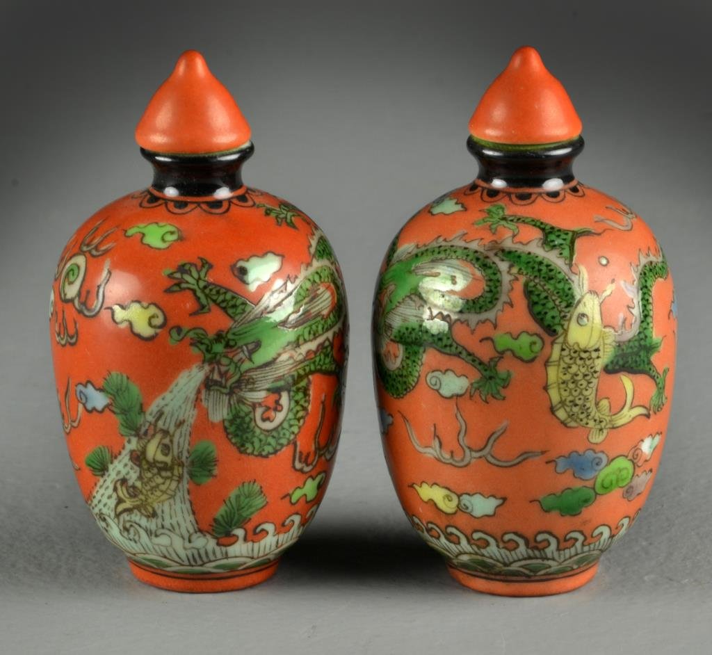 (2) Chinese Painted Porcelain Snuff Bottles: Finely painted with similar depiction of five clawed dragon with koi fish, flaming pearl and ruyi clouds, one also with depiction of mythical beast, bases bearing four character mark in underglaze blu