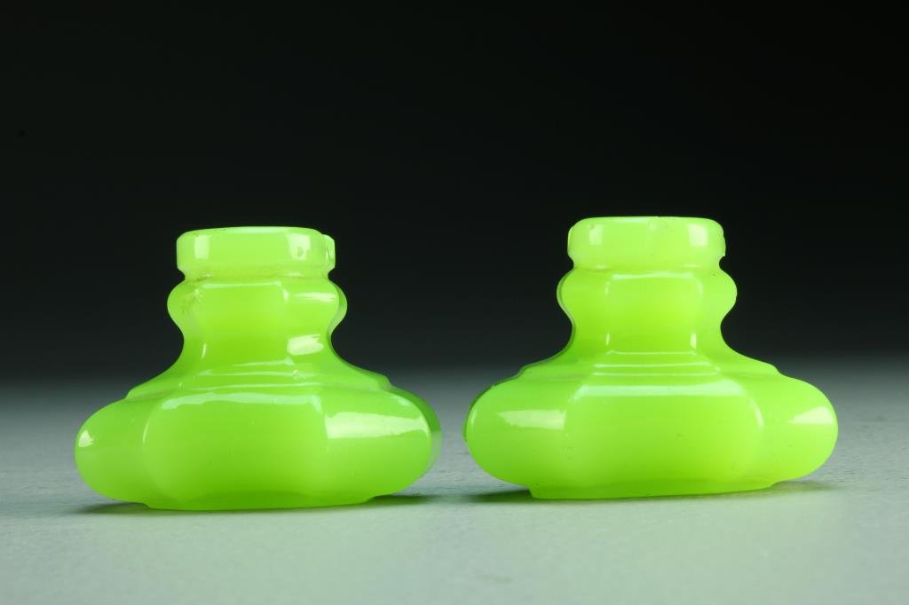 Pair Antique Vaseline Glass Door Knobs: Of octagonal rectangular shape, measures 2.5"W x 1.75"D, circa 19th century. Condition, one with chip to face.