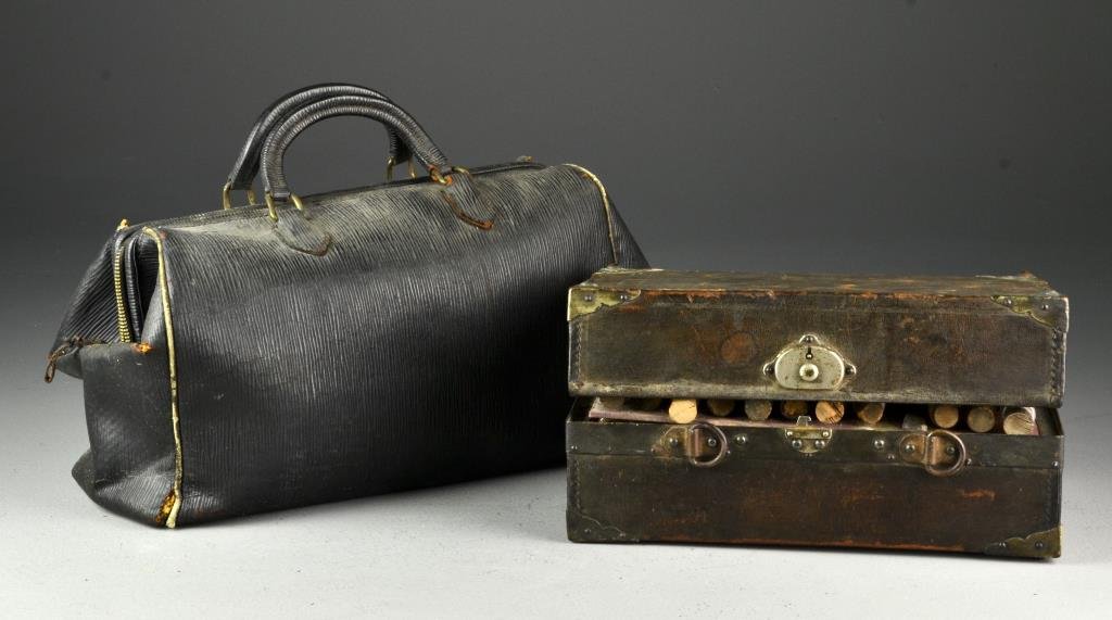 (2) A Fitted Apothecary Case & Doctor's Bag: To include a traveling apothecary case with two compartments, containing several vials of powders and pills in fitted metal slots, having handwritten labels and some with dosing instructions, along wi
