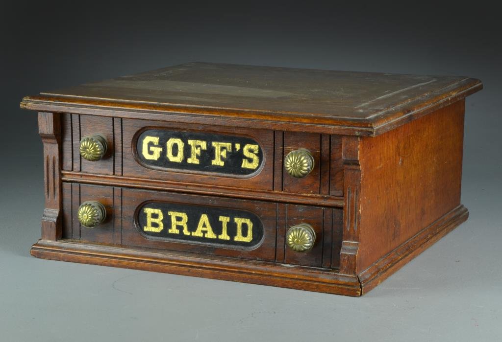 Antique Goff's Two Drawer Spool Cabinet: Oak spool cabinet with two dovetailed drawers and original brass pulls, 8" H x 17.5" W x 18.5" D, circa late 19th-early 20th century. From the collection of the late Anthony "Tony" Orlando Dearborn He