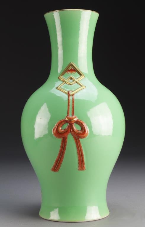 Chinese Contemporary Porcelain Vase: Having a unique light green glaze, molded to each side with simulated hung ribbon and iron red bats, base bearing seal mark in underglaze iron red, 12.75"H.