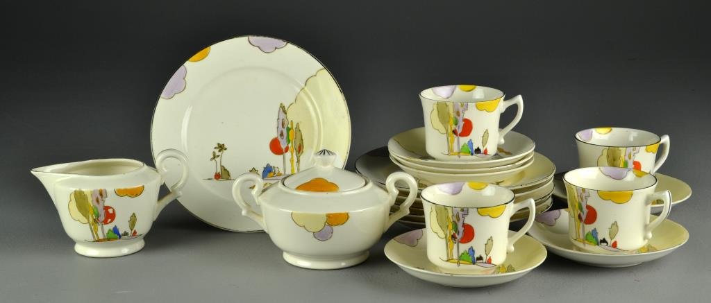 (18) Pcs Nippon Art Deco Partial Tea Set: To inlcude a creamer and covered sugar, four cups, six saucers, and seven dessert plates, all decorated in polychrome enamels to depcit landscapes, all marked Nippon, all with slight wear to trim on e