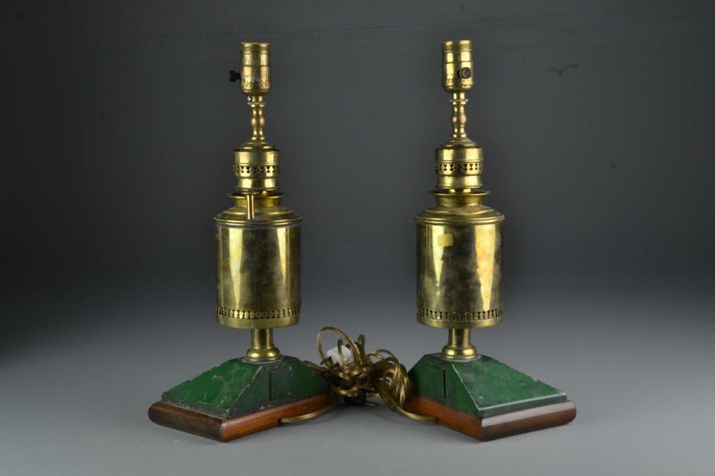 Pr Antique French Brass Oil Lamps: Having pierced design to neck and body of brass, formerly oil lamps now electrified, mounted on a painted tin and wooden base, stamped "Lampe Electrique Paris" to neck, both measure 16.5"H, circa late