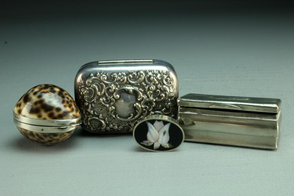 (4) European and Mexican Sterling & Silver Plate Boxes: To include a Gucci sterling and cowrie shell box, a Mexican sterling onyx and mop pill box, a Victorian silver embossed box and a silver plate over copper casket form box, circa late 19th and 20th cen