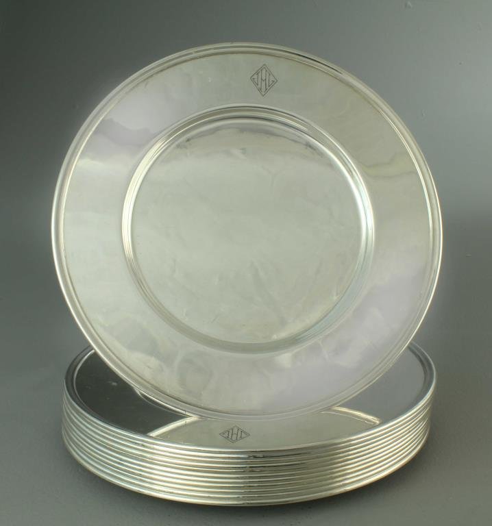 (12) Set of Antique Rogers Bros Silver Plate Chargers: To include 12 charger plates, undersides marked "1847 Rogers Bros." with the number 00406, each having JAG monogrammed rim, measuring 11"D, circa 19th century. Condition: surface wear and some abrasio