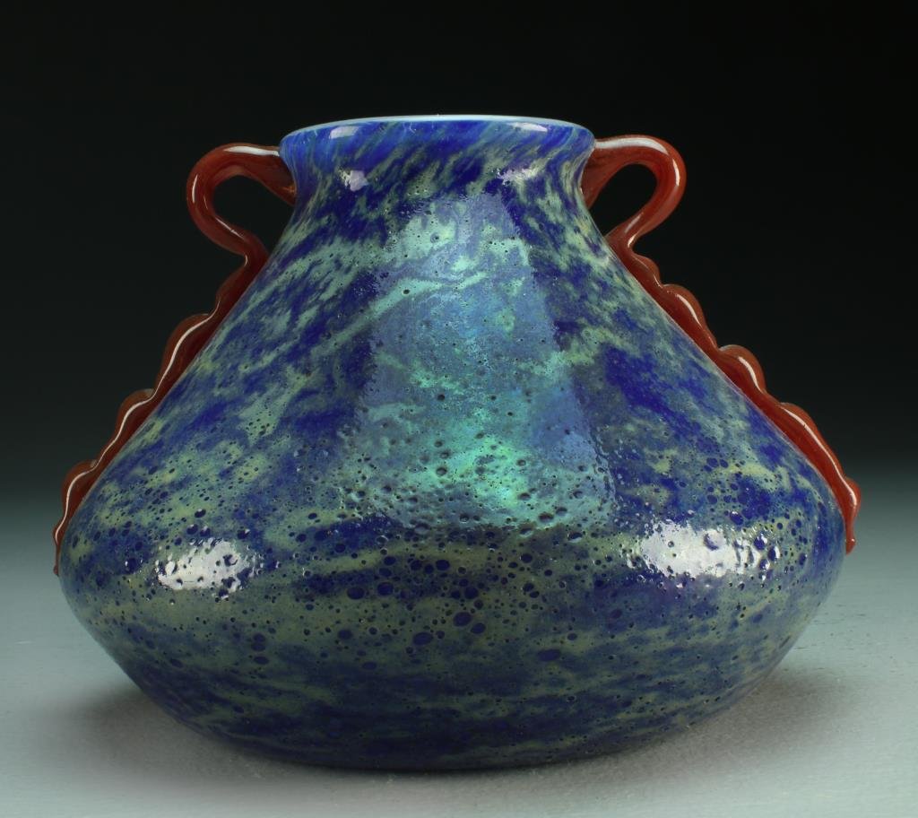 A Loetz Quality Cased Glass Open Vase: Of squat form having applied handles against an ocean blue ground, having a polished button pontil, measures 8"D x 6"H, circa early-mid 20th century.