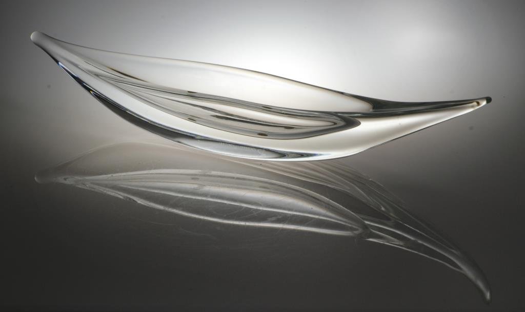 Daum France Art Glass Sculpture: Having an elegant canoe form with oblong reservoir, signed "Daum France" to bottom center, measures 14.25"W, circa 20th century.