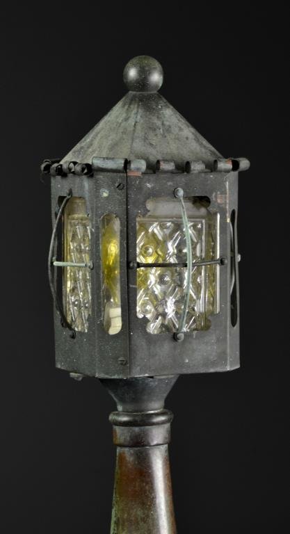 A Large Antique Trench Art Floor Lantern: Having an attractive green-blue patinaed artillery shell topped with a moulded glass lantern encased in tin, measures 50"H, circa early 20th century. Condition, having some electronic hardware, but la