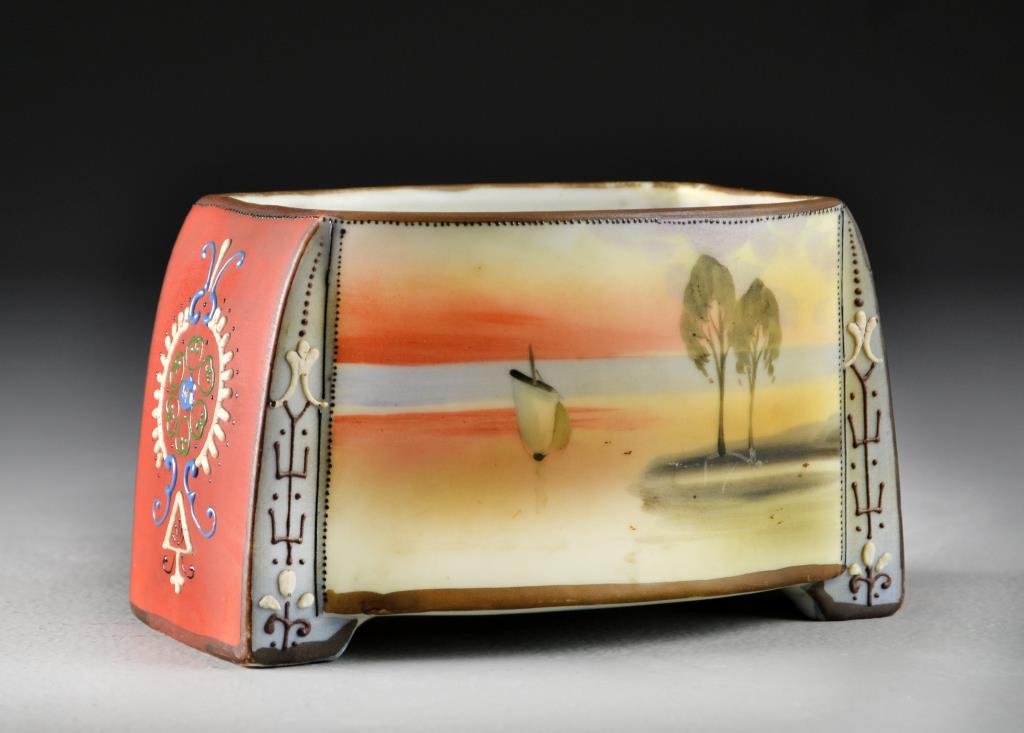 A Nippon Moriage Porcelain Tobacco Jar: Hand painted to depict a sea scape with boats to front and reverse, having moriage beaded accents throughout, underside marked Hand Painted Nippon with hallmark, measures 3.5"H x 6"W, circa 20th centu