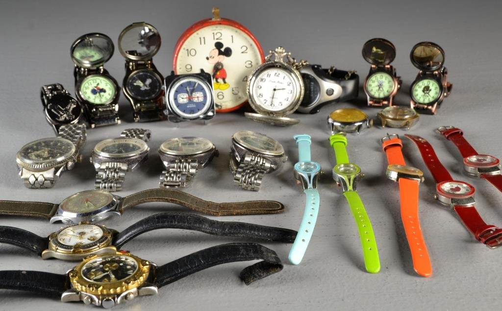 (20+) Assorted Wrist Watches: To include several wrist watches of various materials and sizes, along with a Mickey Mouse alarm clock and a pocket watch, circa 20th century. We do not guarantee working order of clocks and watches a