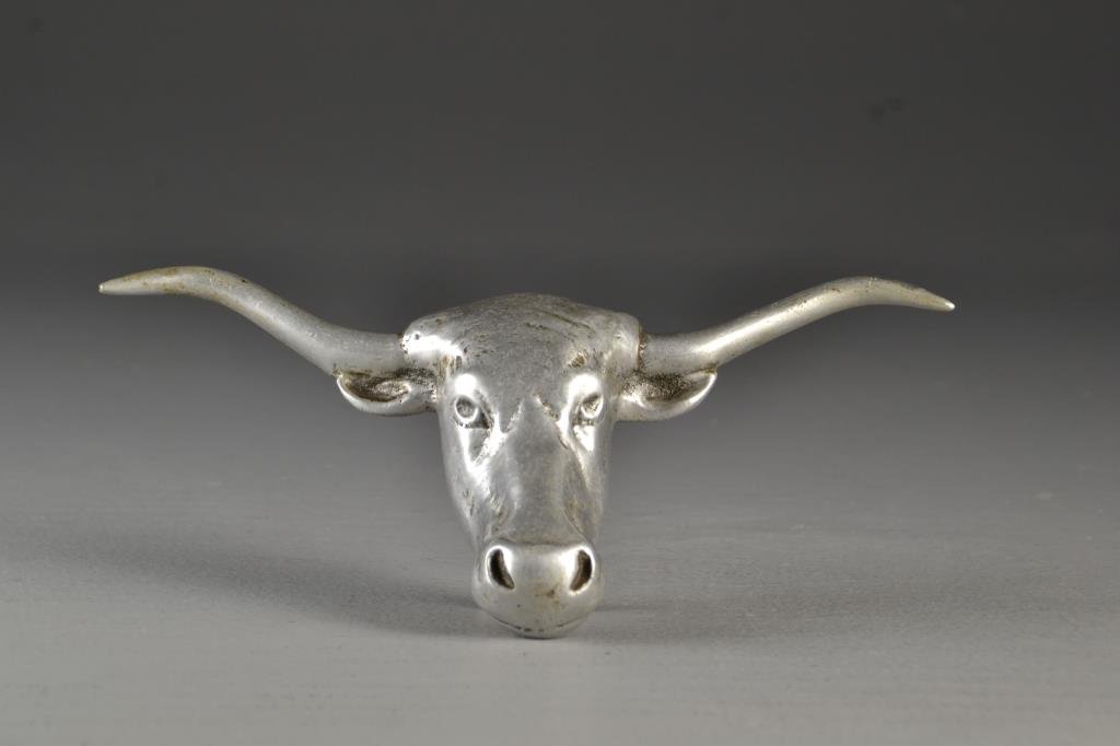 A Polished Aluminum Longhorn Hood Ornament