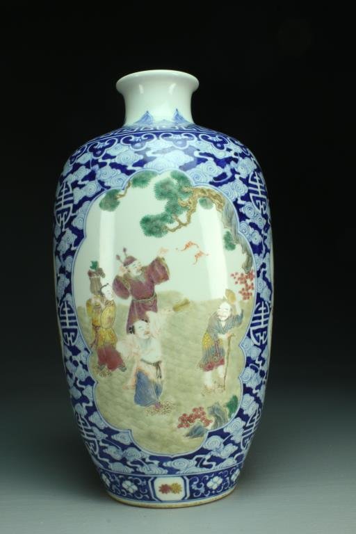 Chinese Qing Famille Rose Porcelain Vase: Finely painted with four cartouches depicting figures in landscapes and Buddhist symbols, the balance painted in blue and white to depict bats, ruyi clouds, and Shou symbols, raised on short foot ring
