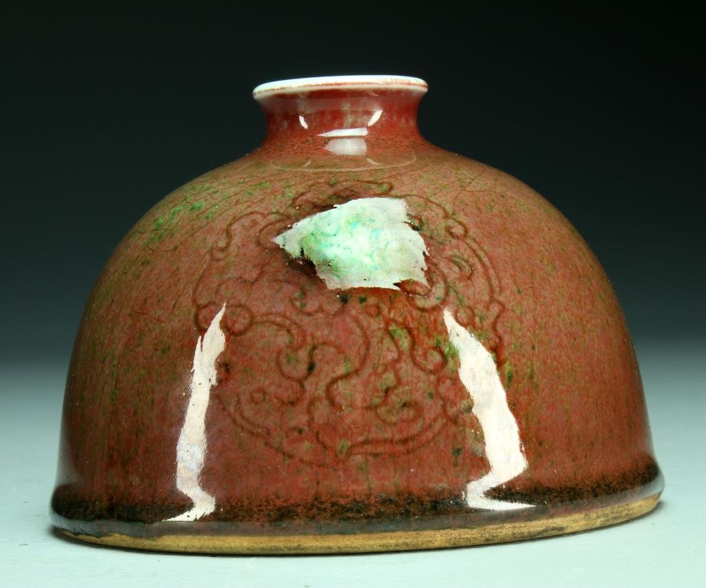 Chinese Monochrome Glaze Water Pot: Having three archaic style dragons to the body, raised on short foot ring, the base having six character Kangxi mark in underglaze blue, 3.75"H, circa late 19th/early 20th century.