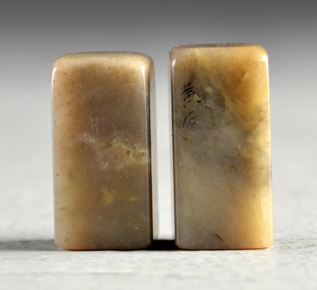Pr. Chinese Hardstone Seal Chops in Box: The chops with two character mark to one side, the seal faces carved with two or three character mark, the carved hardstone box having lines of calligraphy on the lid, the base with carved seal mark, 