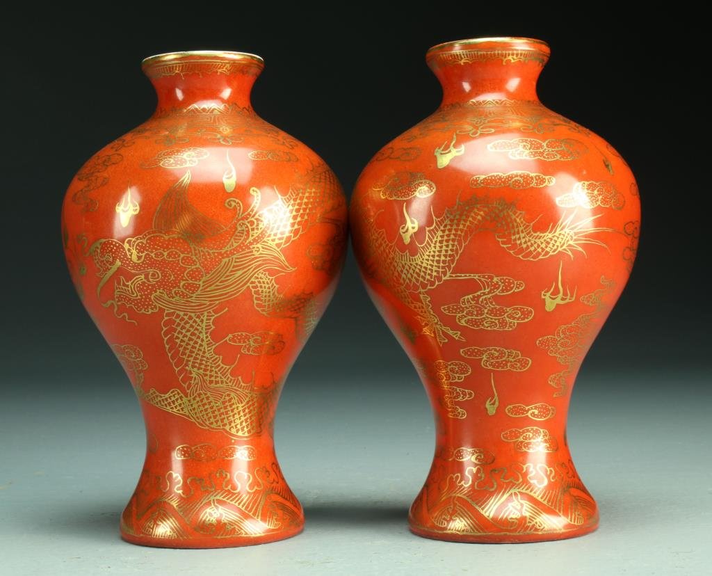 Pr. Chinese Republic Gilt Decorated Iron Red Vases: Finely painted in gilt to depict a dragon amongst ruyi clouds chasing a flaming pearl, raised on short foot ring, base having four character Qianlong mark within double square in iron red underglaze, 
