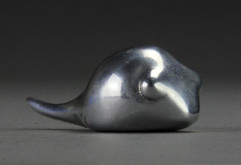 Polished Aluminum Tadpole Retailed By Harrods: A polished aluminum tadpole, artist unknown, retailed by Harrods of Canada, 2.75"L, circa 20th century. Provenance: Formally in the collection of Gary Culpepper of Culpepper Galleries-Santa Fe, New Me