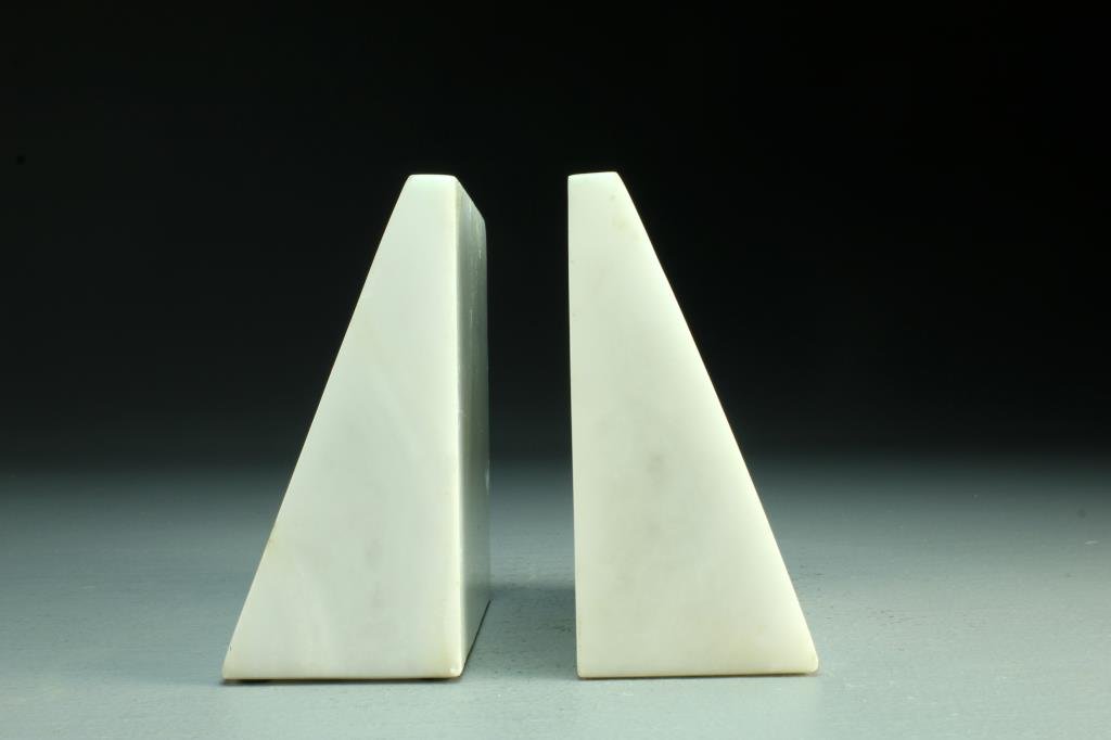 Pr. Raymor Italian Marble and Copper Bookends: Of modernistic design, both in triangular form with copper inserts, inscribed to base "Italy, Raymor, 86, XII", measures 5.25"H, circa 20th century. Condition, bookends having several knicks to edges.
